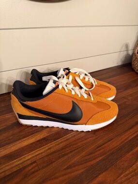 Nike women’s Pacific Orange and Black Retro Runner Sneakers